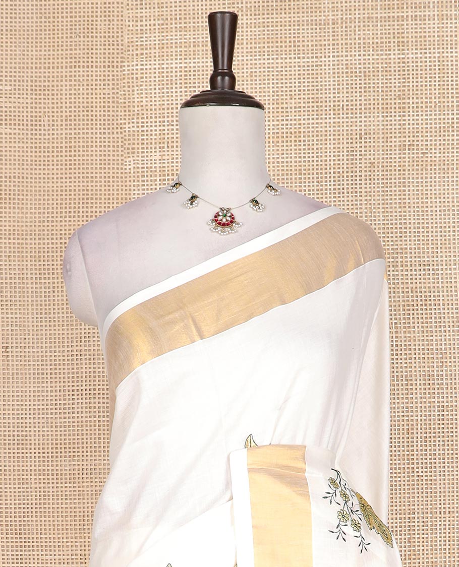 Cream floral motifs embroidered Kerala cotton saree, bavanji border, and floral motifs embroidered pallu