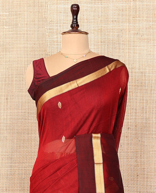 Red Maheshwari Cotton Saree, Adorned with Zari Buttas on Its Body, Complemneted by a Contrast Traditional Zari Border, Pallu Steeped with Buttas, and Paired with a Matching Blouse