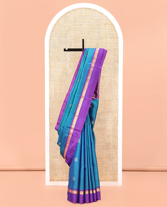 Blue Mayuri Soft Silk Saree Spotlighted with Zari Buttas All Over Its Body, Complemented by Kal Erangina Border of Vanki Designs, Diagonally Woven Pallu and Paired with a Contrast Blouse