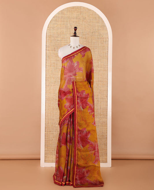 Mustard digital print chiffon shimmer saree with lace border & self pallu along with printed blouse