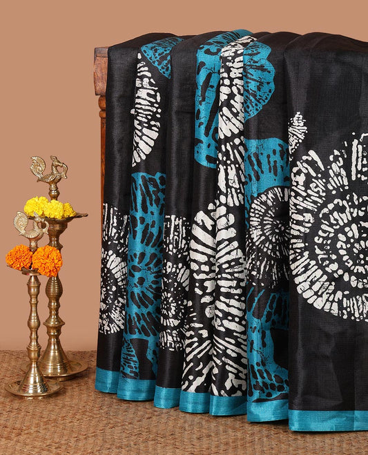Black batik-style uniquely printed khadi cotton saree, contrast blue piping border & printed pallu