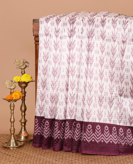 White ikat-style printed Litchi crushed saree, contrast purple ikat border, pallu of ikat chevron & dots & ikat printed blouse