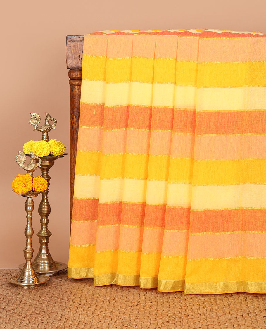 Orange-shaded striped khadi cotton saree, zari piping border, multi-color tassels pallu & colorful striped blouse