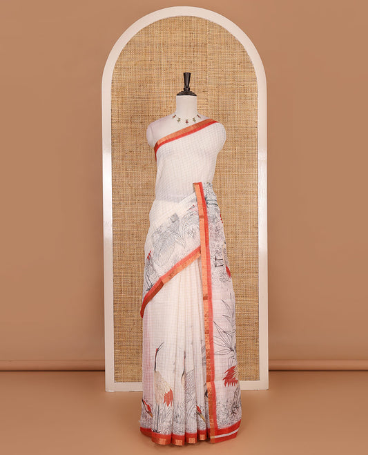 White with orange zari checks linen saree with contrast border and unique designs of pallu along with contrast plain blouse