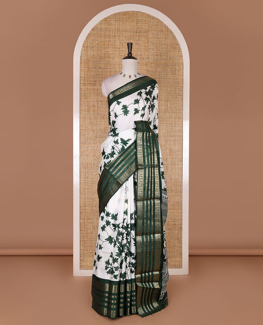 Green leaf motifs printed dola silk saree, contrast traditional zari border of Rudraksham and peacock motifs, geometric printed pallu and contrast printed blouse