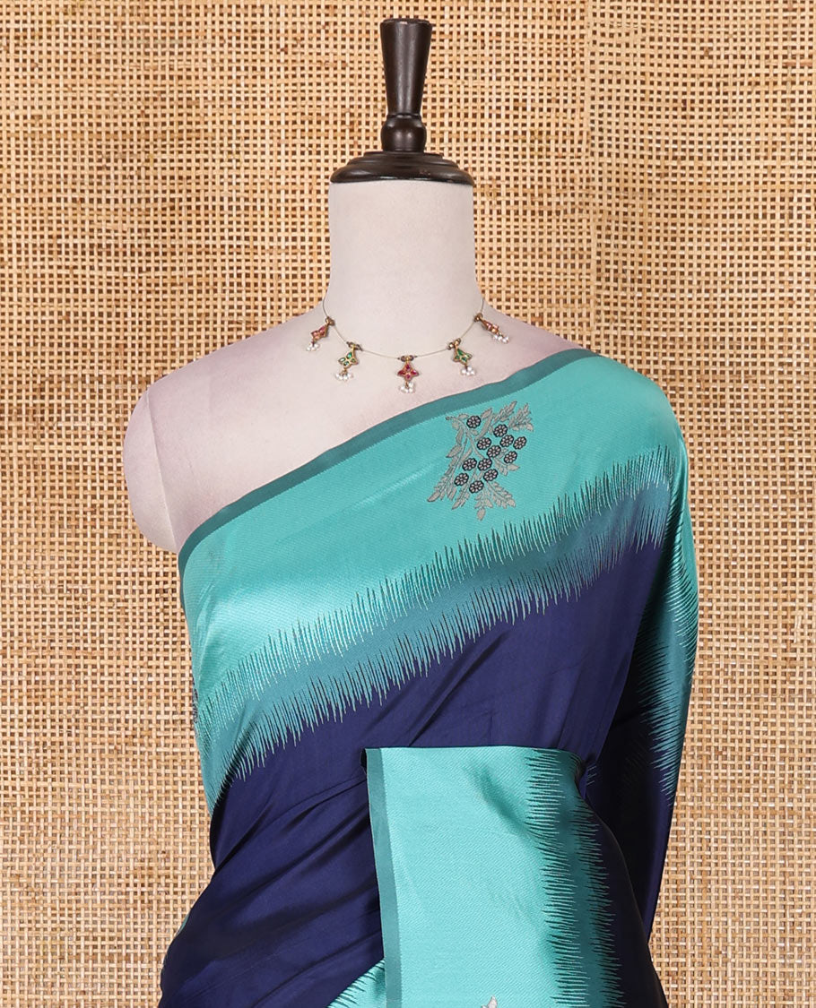 Navy blue-turquoise floral buttas elite soft silk saree, contrast floral buttas border, and pallu of Mughal-style intricate zari designs