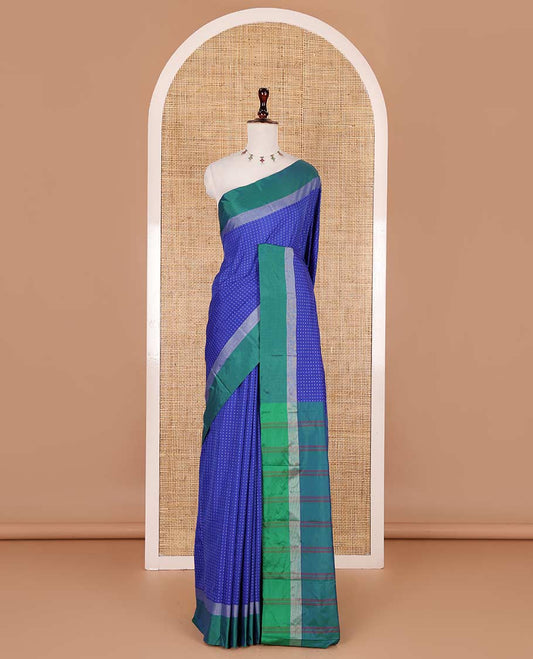 Royal blue-green plus-shaped buttas steeped semi-soft silk saree, contrast satin border of stripes, striped pallu, and contrast blouse