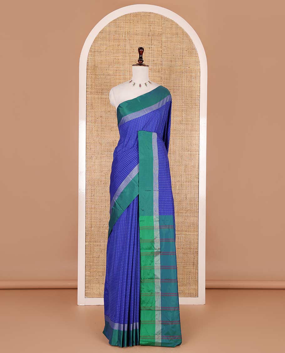 Royal blue-green plus-shaped buttas steeped semi-soft silk saree, contrast satin border of stripes, striped pallu, and contrast blouse