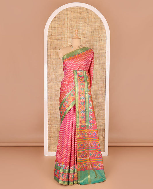 Pink chevron striped patola saree, contrast traditional zari and patola printed border, patola printed pallu, and a contrast blouse