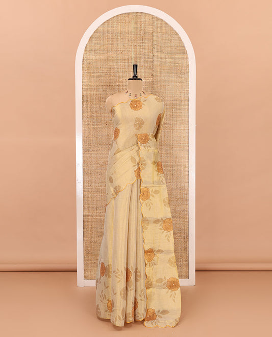 Gold and yellow rose motifs printed with mirror work tissue saree, scallop embroidered border, printed pallu, and a contrast blouse
