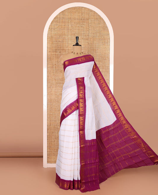 Half-white and purple Veldhari striped Sungudi cotton saree, contrast traditional border of peacock buttas, zari striped pallu, and a contrast blouse
