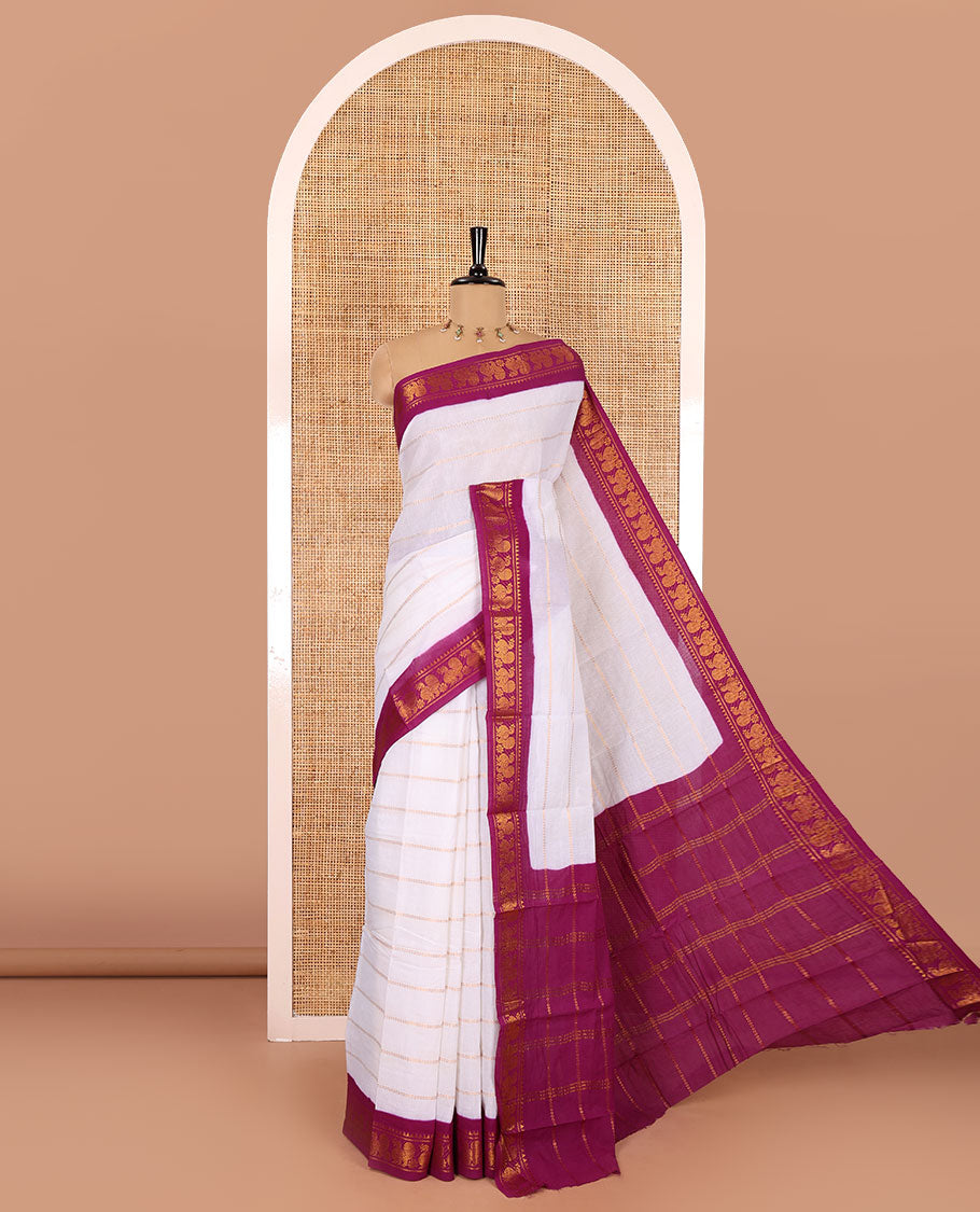 Half-white and purple Veldhari striped Sungudi cotton saree, contrast traditional border of peacock buttas, zari striped pallu, and a contrast blouse