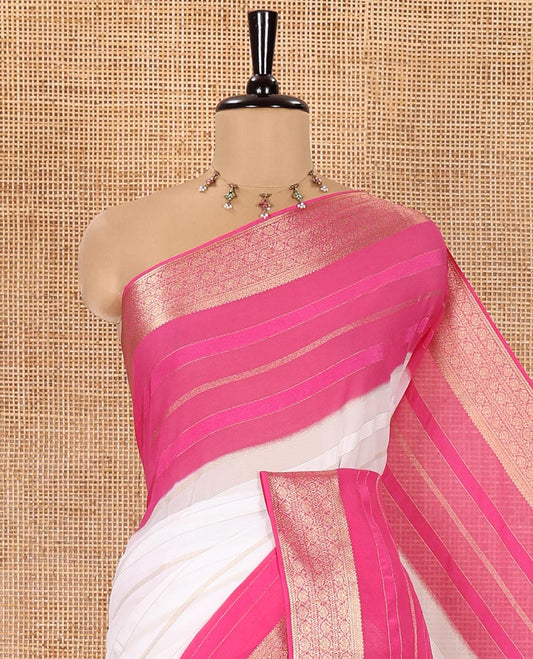 White and Rani Georgette Saree, Subtly Sparkled with Horizontal Zari Stripes All Over Its Body, Complemented by a Contrast Traditional Zari Design Border, Gleaming Zari Striped Pallu, and Paired with a Contrast Blouse