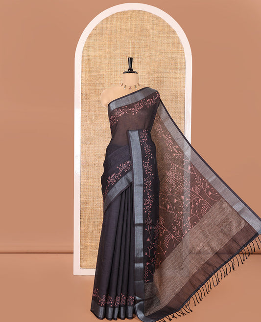 Black Linen Cotton Saree, Subtly Sparkled with Floral Vine Motifs Printed All Over Its Body, Subtle Bavanji Border, Pallu Steeped with Stripes, and Paired with a Floral Printed Blouse