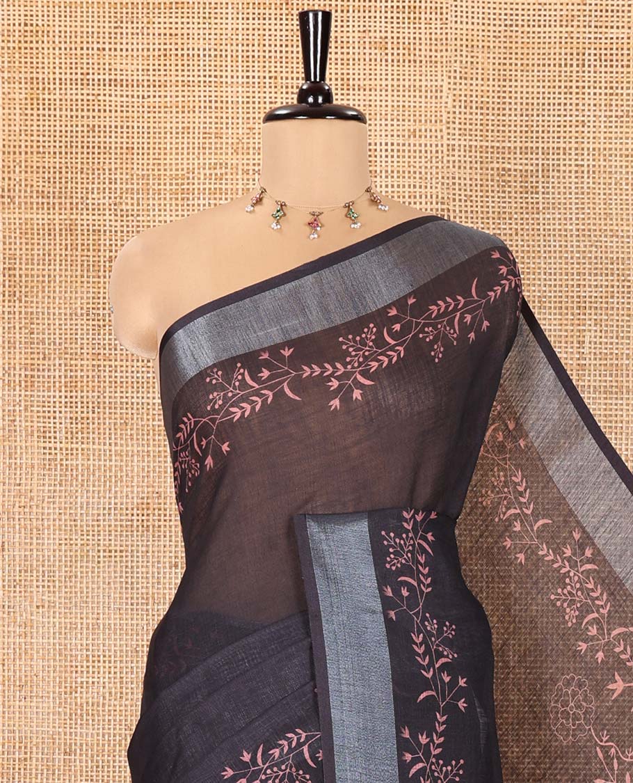 Black Linen Cotton Saree, Subtly Sparkled with Floral Vine Motifs Printed All Over Its Body, Subtle Bavanji Border, Pallu Steeped with Stripes, and Paired with a Floral Printed Blouse
