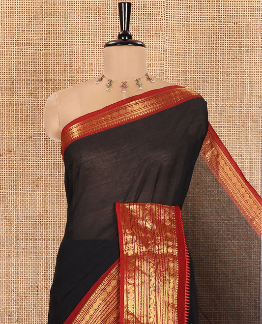 Black Plain Chettinad Cotton Saree, Complemented by a Contrast Traditional Zari Design Woven Border of Rudraksham Designs, Subtly Striped Pallu, and Paired with a Matching Blouse