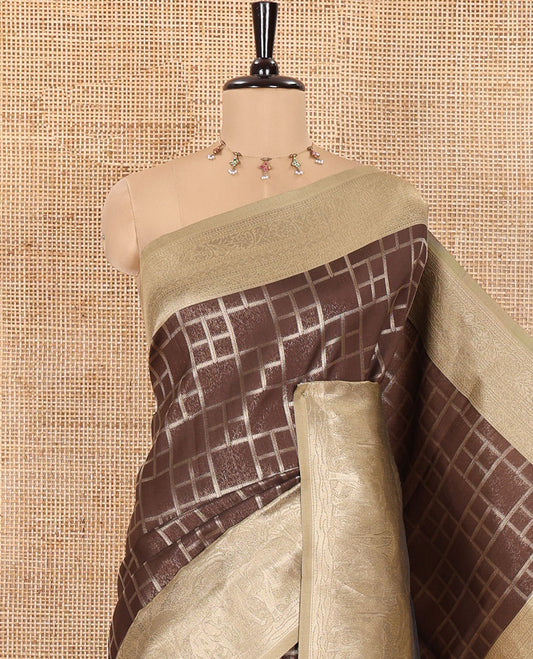Brown Elite Soft Silk Saree, Highlighted by Checked Design on Its Body, Complemented by a Contrast Border of Jungle-Themed Flora-Fauna Motifs, a Pallu of Checked Design, and Paired with a Contrast Blouse