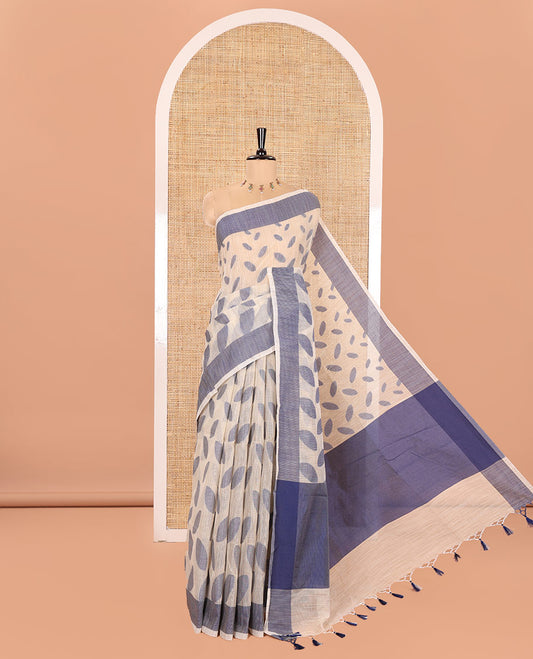 Chikku and Blue Manipuri Cotton Saree, Steeped with Leaf Motifs Printed on Its Body, Contrast Plain Border, Captivating Contrast Plain Pallu, and Paired with a Matching Blouse