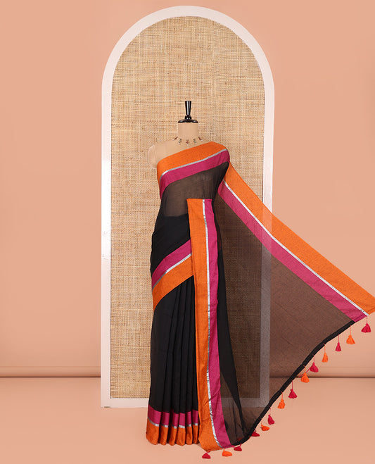 Black Plain Khadi Mul Cotton Saree, Complemented by Contrast Pink-Orange Border, Self-Pallu, and Paired with a Matching Blouse