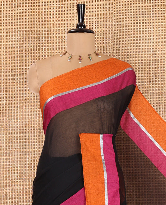 Black Plain Khadi Mul Cotton Saree, Complemented by Contrast Pink-Orange Border, Self-Pallu, and Paired with a Matching Blouse