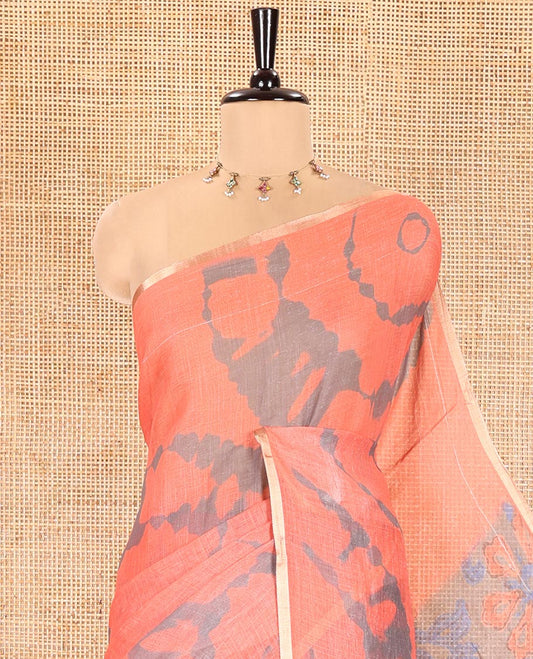 Orange Linen Cotton Saree, Adorned with Shibori Printed on Its Body, Subtle Piping Border, Pallu Features Floral Print, and Paired with a Contrast Floral Printed Blouse