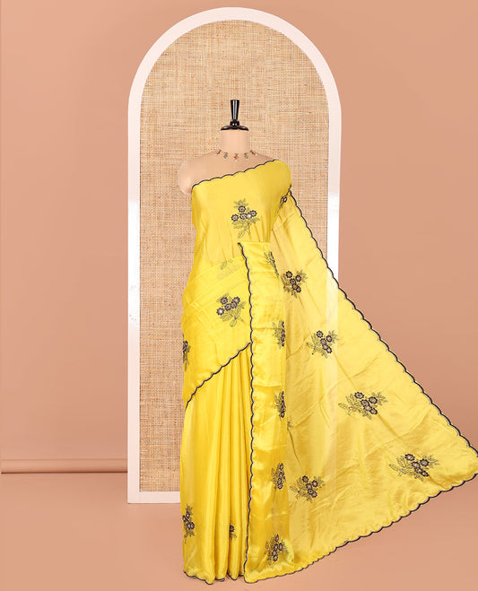 Yellow Rangoli Chiffon Saree, Beautified with Flower-Style Motifs Embroidered on Its Body, a Subtle Scallop Embroidered Border, a Self-Pallu, and Paired with a Contrast Embroidered Blouse