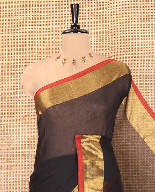 Black Plain Khadi Mul Cotton Saree, Complemented by a Contrast Zari Border, a Self-Pallu, and Paired with a Matching Blouse