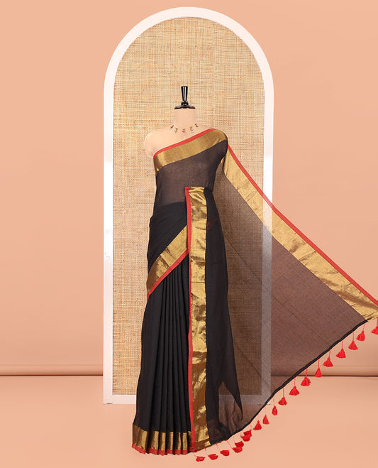Black Plain Khadi Mul Cotton Saree, Complemented by a Contrast Zari Border, a Self-Pallu, and Paired with a Matching Blouse