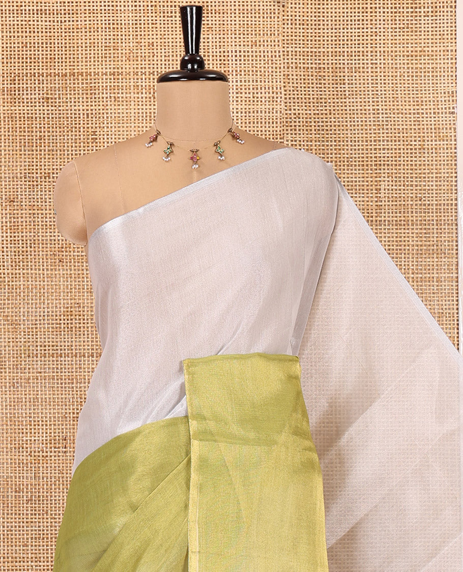 Borderless Lime Green Plain Tissue Saree, a Self-Pallu with Tassels, and a Matching Blouse