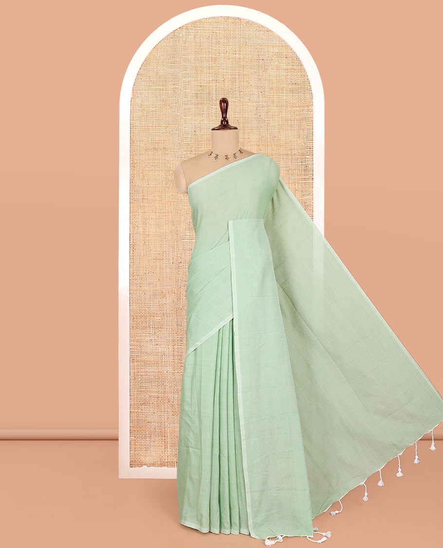 Borderless Pista Green Plain Khadi Cotton Saree, a Self-Pallu with Tassels, and a Matching Blouse