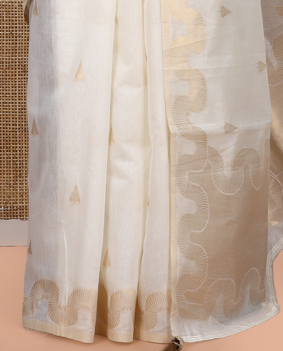 Cream Chanderi Cotton Saree, Adorned with Zari Buttas, Highlighted by Zari Border, Grand Pallu, and a Matching Blouse