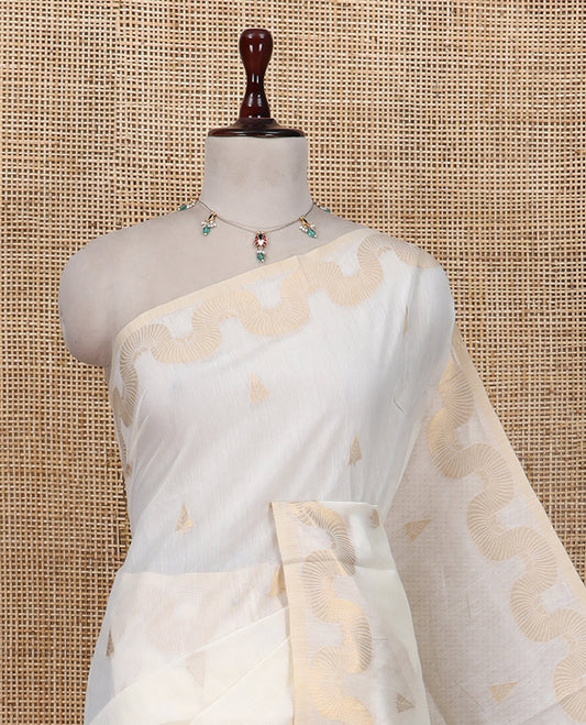 Cream Chanderi Cotton Saree, Adorned with Zari Buttas, Highlighted by Zari Border, Grand Pallu, and a Matching Blouse