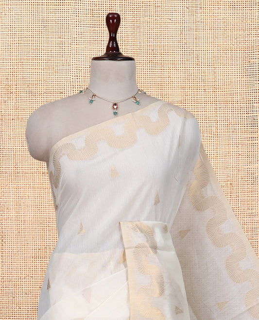 Cream Chanderi Cotton Saree, Adorned with Zari Buttas, Highlighted by Zari Border, Grand Pallu, and a Matching Blouse