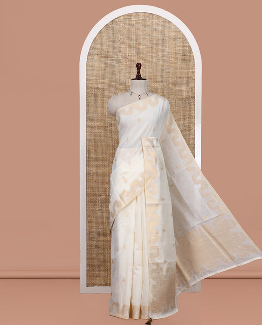 Cream Chanderi Cotton Saree, Adorned with Zari Buttas, Highlighted by Zari Border, Grand Pallu, and a Matching Blouse