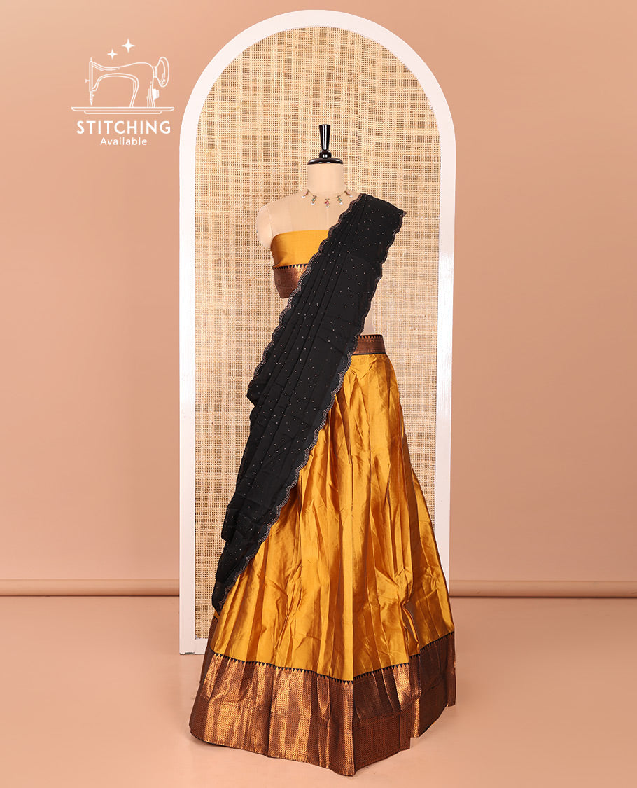 Mustrad Taffeta Silk Half-Saree Featuring a Plain Skirt, Adorned with a Contrast Traditional Zari Design Border, Paired with a Matching Blouse, and a Georgette Scallop-Bordered Stone Work Dhavani