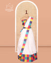 Cream Banarasi Silk Half-Saree Features Buttas Skirt, Contrast Madras Checked Blouse, and a Matching Semi-Silk Dhavani