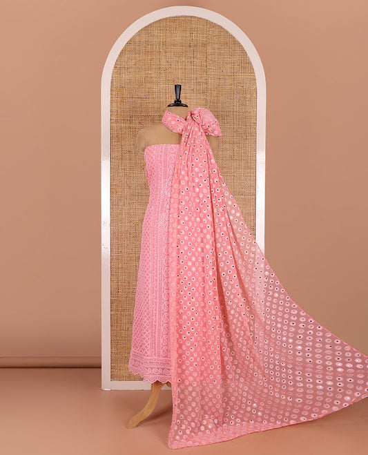 Dark peach material chudidar set, paisleys and jaal schiffli sequins embroidered mul georgette top, a matching bottom, and a mirror work dupatta