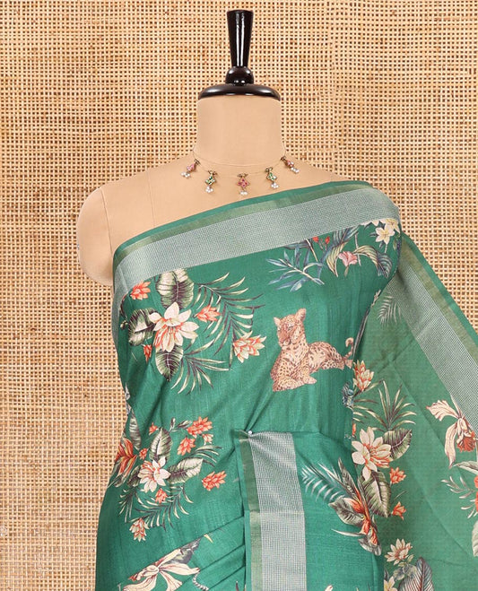Green tropical floral and fauna motifs printed fancy tussar saree, resham border, self-pallu, and a matching blouse of print with resham thread stripes