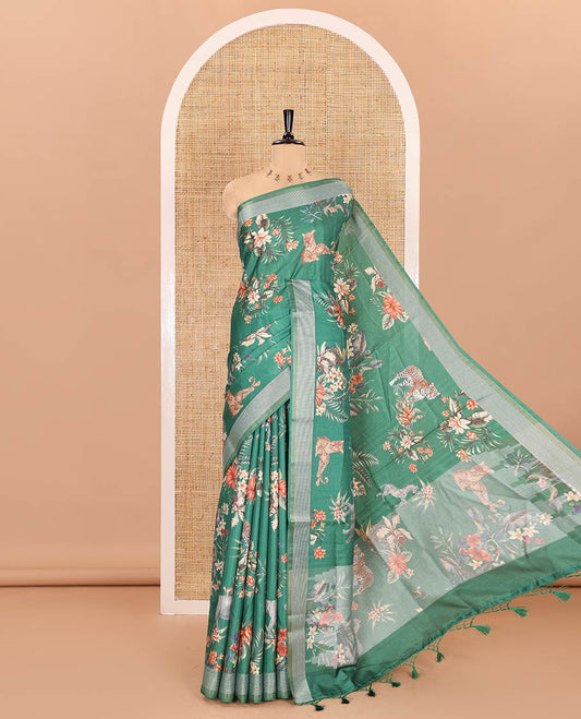 Green tropical floral and fauna motifs printed fancy tussar saree, resham border, self-pallu, and a matching blouse of print with resham thread stripes