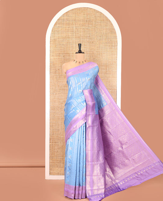 Sky Blue Litchi Saree, Enriched with Vaira Oosi Stripes and Zari Buttas on Its Body, Complemented by a Contrast Rettai Pettu Traditional Zari Design Border, an Intricately Designed Pallu, and Paired with a Contrast Blouse