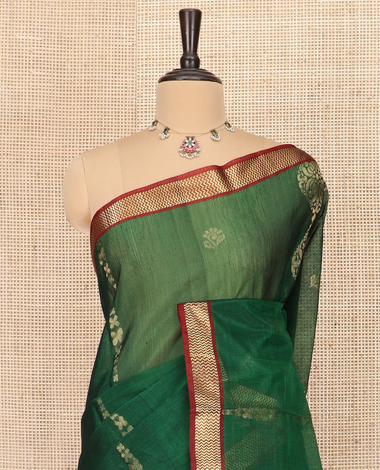 Green Silk Cotton Saree Beautified with Buttas All Over the Body, Complemented by a Contrast Chevron Striped Zari Border, Featuring a Contrast Pallu Steeped With Geometric Designs, and Paired with a Contrast Blouse