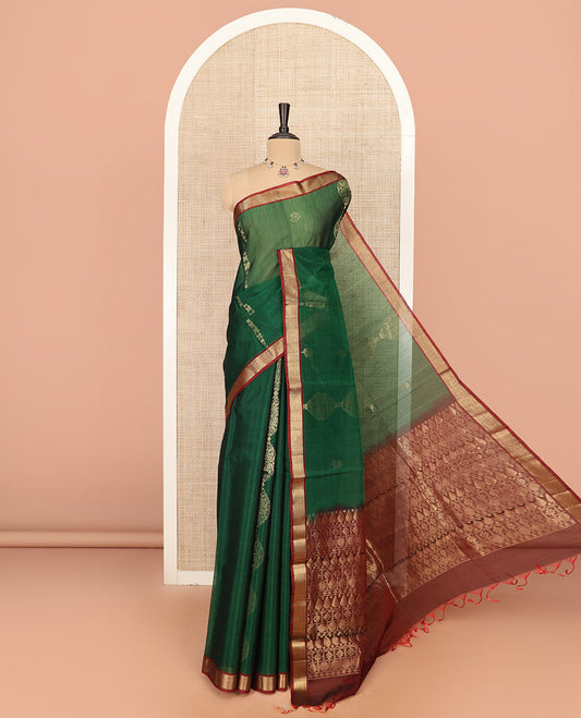 Green Silk Cotton Saree Beautified with Buttas All Over the Body, Complemented by a Contrast Chevron Striped Zari Border, Featuring a Contrast Pallu Steeped With Geometric Designs, and Paired with a Contrast Blouse