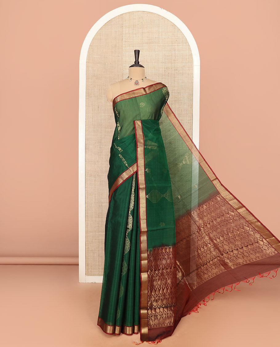 Green Silk Cotton Saree Beautified with Buttas All Over the Body, Complemented by a Contrast Chevron Striped Zari Border, Featuring a Contrast Pallu Steeped With Geometric Designs, and Paired with a Contrast Blouse
