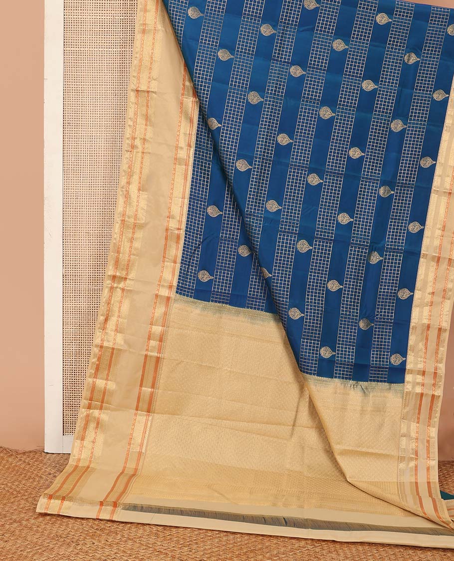 Blue zari buttas and zari checked Vasundhara silk mix saree, contrast border of thilakam, muthu, banaras, poun, and mayil designs, and then kuli kann pallu