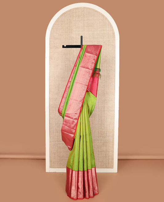 Green zari buttas silk saree with contrast border of rekku, kathir, cross kathir, laddu kamalam, poo chakram, mayil kann, mayil, neli, and yaanai designs, and jaal pallu