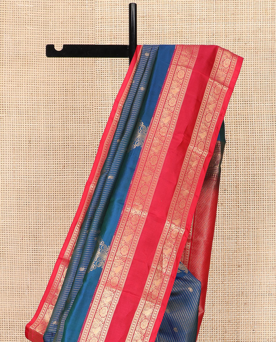 Blue Vasundhara Silk Saree Elegantly Detailed with Zari Buttas and Zari Micro-Checks, Complemented by a Contrast Rettai Pettu Border of Muthu, Rudraksham, and Kodi Mayil Designs, Pallu Steeped Kathir Designs, and a Contrast Blouse