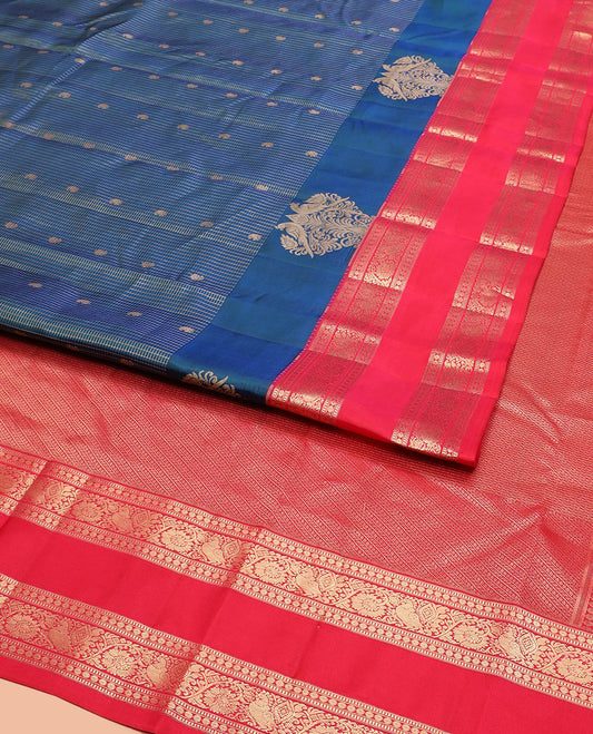 Blue Vasundhara Silk Saree Elegantly Detailed with Zari Buttas and Zari Micro-Checks, Complemented by a Contrast Rettai Pettu Border of Muthu, Rudraksham, and Kodi Mayil Designs, Pallu Steeped Kathir Designs, and a Contrast Blouse