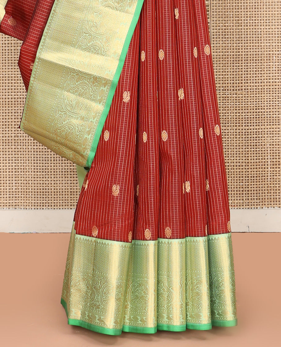Brown Vasundhara Silk Saree, Detailed with Mayil and Chakram Buttas Enclosed Checks, Complemented by Contrast Border of Rekku, Mayil Kann, and Mayil Manga Designs, Grand Jaal Pallu and Paired with a Contrast Blouse