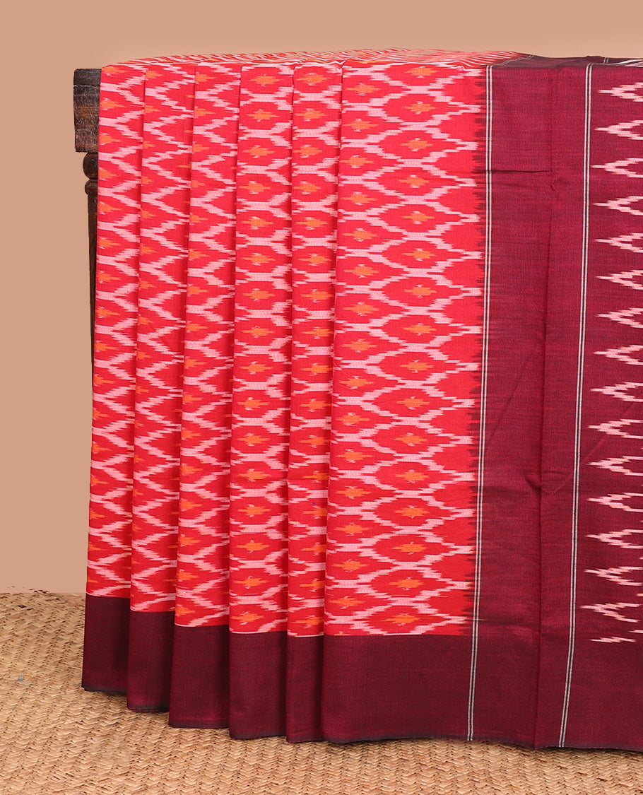 Red ogee patterned ikkat cotton saree, contrast plain border, and pallu of triangle buttas