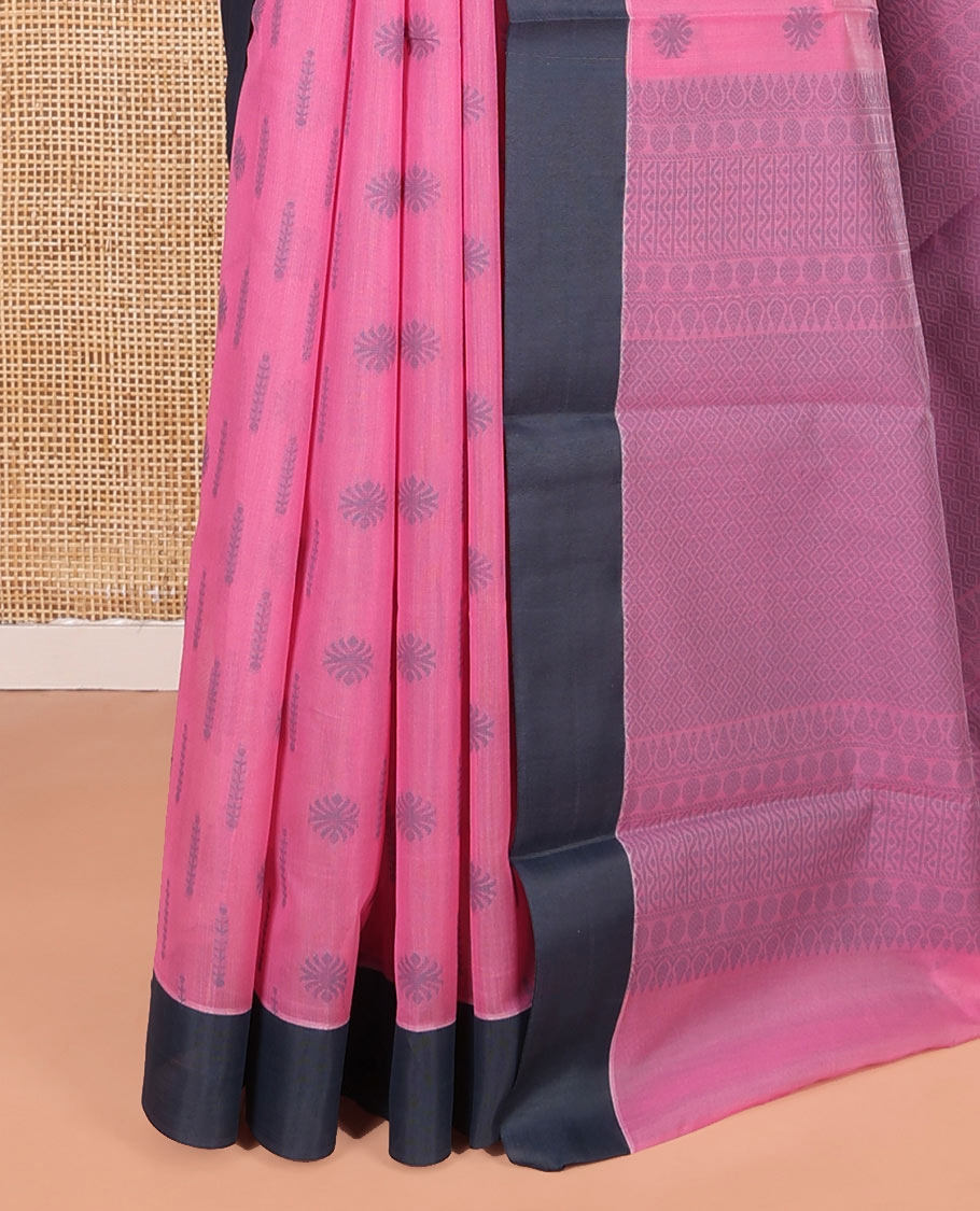 Pink Semi-Silk Cotton Saree, Subtly Sparkled with Buttas All Over Its Body, Complemented by Contrast Border, Geometric Patterned Pallu, and Paired with a Matching Blouse